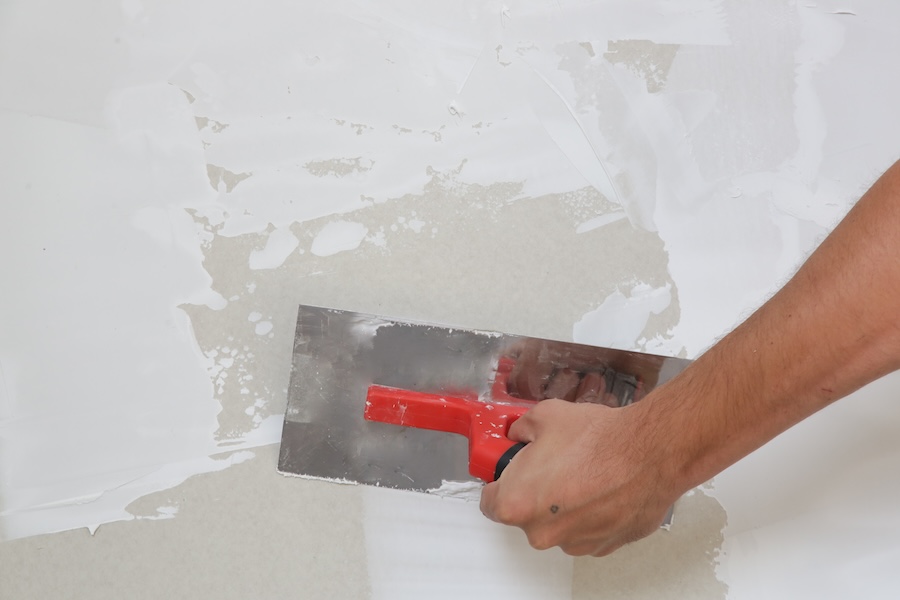 photo of a wall being prepared for paint